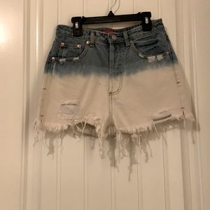 Two toned denim high waisted, cutoff short. Size small. Never worn.